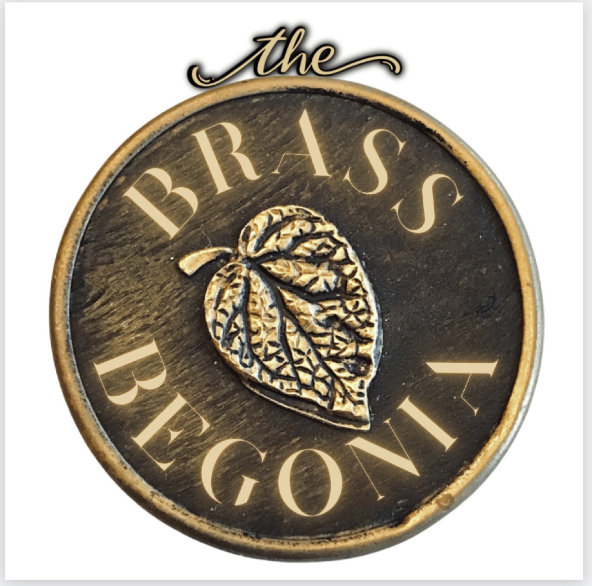 The antique brass begonia leaf that gave the shop its name